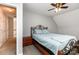 Cozy bedroom with an ornate metal bed frame and light blue bedding, complemented by a ceiling fan at 270 Kilmer Ln, Mooresville, NC 28115