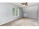 Cozy bedroom with carpet, white walls, window, and closet door at 270 Kilmer Ln, Mooresville, NC 28115