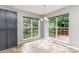 Breakfast area featuring a table, large windows, and sliding door access to the wooden deck at 270 Kilmer Ln, Mooresville, NC 28115