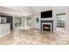 Spacious living room featuring tile floors, a fireplace, and views of the back yard at 270 Kilmer Ln, Mooresville, NC 28115