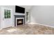 Spacious living room featuring tile floors, a fireplace, and views of the back yard at 270 Kilmer Ln, Mooresville, NC 28115