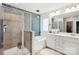 Modern bathroom with a walk-in shower, soaking tub, and elegant tile accents at 344 Kennebel Pl, Fort Mill, SC 29715