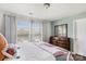 Bright bedroom with hardwood floors, matching furniture, and large windows at 344 Kennebel Pl, Fort Mill, SC 29715