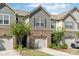 Attractive townhome displaying a combination of brick and shake siding, featuring a single-car garage and verdant landscaping at 344 Kennebel Pl, Fort Mill, SC 29715