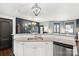 Well-equipped kitchen boasting granite countertops, a stainless steel sink, and modern fixtures for a delightful cooking experience at 344 Kennebel Pl, Fort Mill, SC 29715