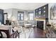 Inviting living room with a corner fireplace, comfortable seating, and tasteful decor creating a cozy atmosphere at 344 Kennebel Pl, Fort Mill, SC 29715
