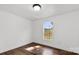 Bedroom with wood floors, natural light, and views of the landscape at 41042 Dennis Rd, Albemarle, NC 28001