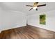 Well-lit bedroom featuring hardwood floors, neutral walls, and a ceiling fan at 41042 Dennis Rd, Albemarle, NC 28001