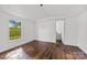 Bedroom featuring wood floors and view of the landscape at 41042 Dennis Rd, Albemarle, NC 28001