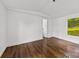 Bedroom featuring wood floors and view of the landscape at 41042 Dennis Rd, Albemarle, NC 28001