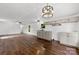Open concept kitchen with modern fixtures, lots of light, and hardwood floors at 41042 Dennis Rd, Albemarle, NC 28001