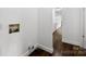 Laundry Room area featuring wood floors and access to the hallway at 41042 Dennis Rd, Albemarle, NC 28001