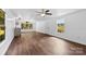 Bright and open living area featuring hardwood floors, natural light, and modern fixtures at 41042 Dennis Rd, Albemarle, NC 28001