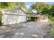 View of the garage, driveway, and partial view of the house from the exterior at 4200 Tyndale Ave, Charlotte, NC 28210