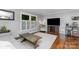 Cozy living room with hardwood floors, neutral walls, and modern decor, creating a comfortable atmosphere at 4200 Tyndale Ave, Charlotte, NC 28210