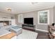 Comfortable living room features a fireplace, dark hardwood floors, and neutral decor at 4200 Tyndale Ave, Charlotte, NC 28210