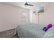 Bedroom with a ceiling fan, a window, and a flatscreen television mounted on the wall at 4313 Gibbon Crossing Dr, Charlotte, NC 28269