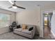 Cozy bedroom with a ceiling fan, window and a comfortable grey sofa at 4313 Gibbon Crossing Dr, Charlotte, NC 28269