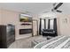 Cozy bedroom featuring a ceiling fan, flatscreen TV, electric fireplace, and seating area at 4313 Gibbon Crossing Dr, Charlotte, NC 28269