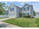 Charming two-story home featuring a gray siding, attached garage, and well-maintained landscaping at 4313 Gibbon Crossing Dr, Charlotte, NC 28269