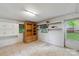 The basement features built-in storage cabinets, shelving, tile floors, and natural light at 46 Donna Dale Se Ave, Concord, NC 28025