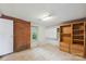 This basement with tile flooring features a white door, window and a light fixture at 46 Donna Dale Se Ave, Concord, NC 28025