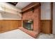 Basement fireplace with brick surround at 46 Donna Dale Se Ave, Concord, NC 28025