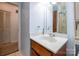 Bathroom with marble countertop vanity and wood cabinets at 46 Donna Dale Se Ave, Concord, NC 28025