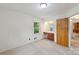 Bright bedroom featuring carpeted floors and a built-in vanity with marble countertop at 46 Donna Dale Se Ave, Concord, NC 28025