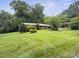 A charming one-story home featuring a well-manicured lawn and beautiful, mature trees at 46 Donna Dale Se Ave, Concord, NC 28025