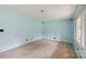 Spacious living room with light blue walls, neutral carpet, and ample natural light at 46 Donna Dale Se Ave, Concord, NC 28025
