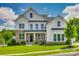 Beautiful two-story home featuring stone accents, a well-manicured lawn, and a welcoming front porch at 509 Abelia Ln, Tega Cay, SC 29708