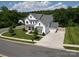 Aerial view showcasing the home, its manicured lawn, and surrounding neighborhood at 509 Abelia Ln, Tega Cay, SC 29708