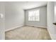 This bedroom offers carpeted floors, neutral walls, and a bright window, creating a cozy retreat at 509 Abelia Ln, Tega Cay, SC 29708