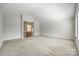 A large, open bonus room with neutral tones and ample space perfect for flexible use at 509 Abelia Ln, Tega Cay, SC 29708
