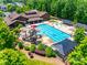 A resort-style community pool featuring a slide, splash pad, and plenty of lounge chairs for relaxing by the water at 509 Abelia Ln, Tega Cay, SC 29708