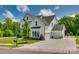 This home boasts great curb appeal with a three car garage and a well-maintained lawn at 509 Abelia Ln, Tega Cay, SC 29708