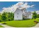 Beautifully landscaped lawn frames this two story home, complete with stone accents at 509 Abelia Ln, Tega Cay, SC 29708