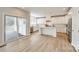 Modern, bright kitchen features white cabinets, stainless appliances, and access to outdoor space at 509 Abelia Ln, Tega Cay, SC 29708