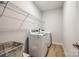 This laundry room boasts modern appliances and ample storage, ensuring functionality and convenience at 509 Abelia Ln, Tega Cay, SC 29708