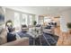 Bright and airy living room with modern furnishings, large windows, and open floor plan at 509 Abelia Ln, Tega Cay, SC 29708