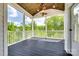 This screened porch offers a serene retreat with views of the lush, green outdoors at 509 Abelia Ln, Tega Cay, SC 29708