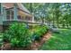 Inviting back deck with black railings and lush hydrangeas blooming along the lattice at 5485 Deer Run Ct, Davidson, NC 28036