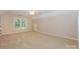 Neutral bedroom with carpet, a window, and a nook at 5485 Deer Run Ct, Davidson, NC 28036
