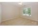 Bright bedroom featuring neutral walls, plush carpet and a window providing ample natural light at 5485 Deer Run Ct, Davidson, NC 28036