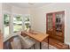 Sunlit home office with hardwood floors, a neutral rug and french doors at 5485 Deer Run Ct, Davidson, NC 28036