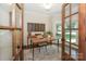Sophisticated home office with french doors, desk and statement art at 5485 Deer Run Ct, Davidson, NC 28036