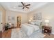 Serene main bedroom with tray ceilings, wood floors, and an en-suite bathroom at 5485 Deer Run Ct, Davidson, NC 28036