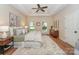 Spacious main bedroom featuring tray ceilings, wood floors, and decorative wall art at 5485 Deer Run Ct, Davidson, NC 28036