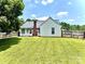 A spacious backyard with a lush green lawn, enclosed by a wooden fence, offering ample space at 5728 Rocbridge Ln, Charlotte, NC 28208